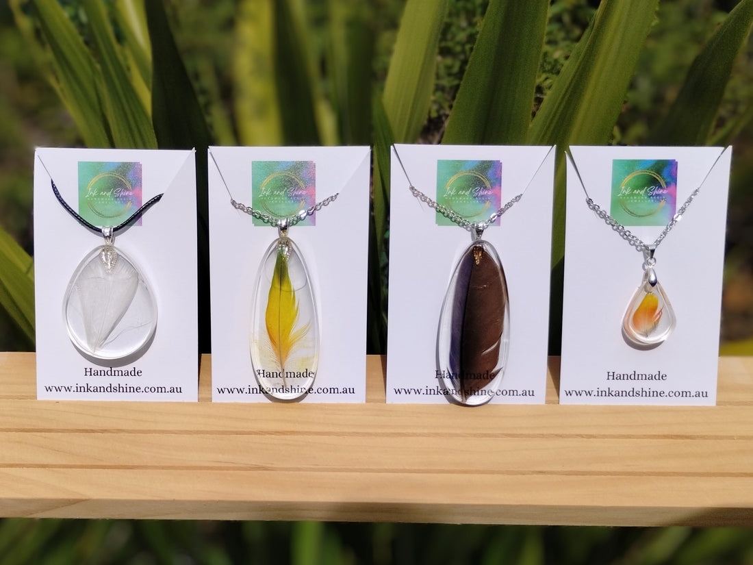 resin pendant necklaces made with real feathers inside