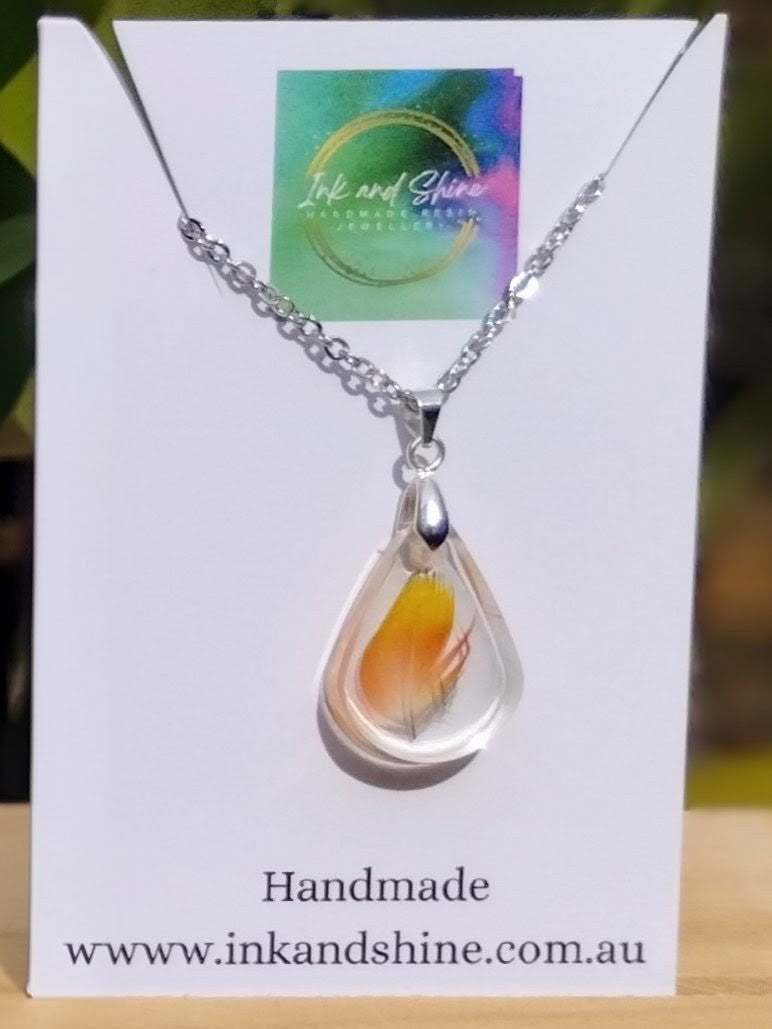 Custom bird feather resin jewellery